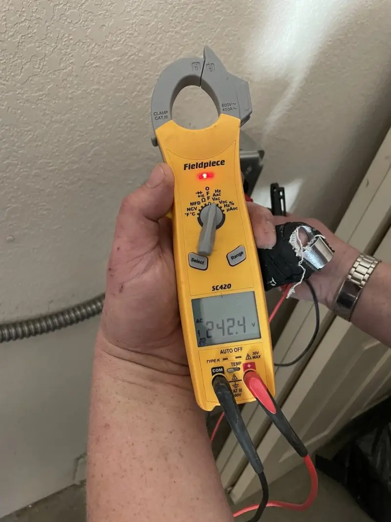 Voltage testing with clamp meter during Circuit Breaker Repair in Devils Lake